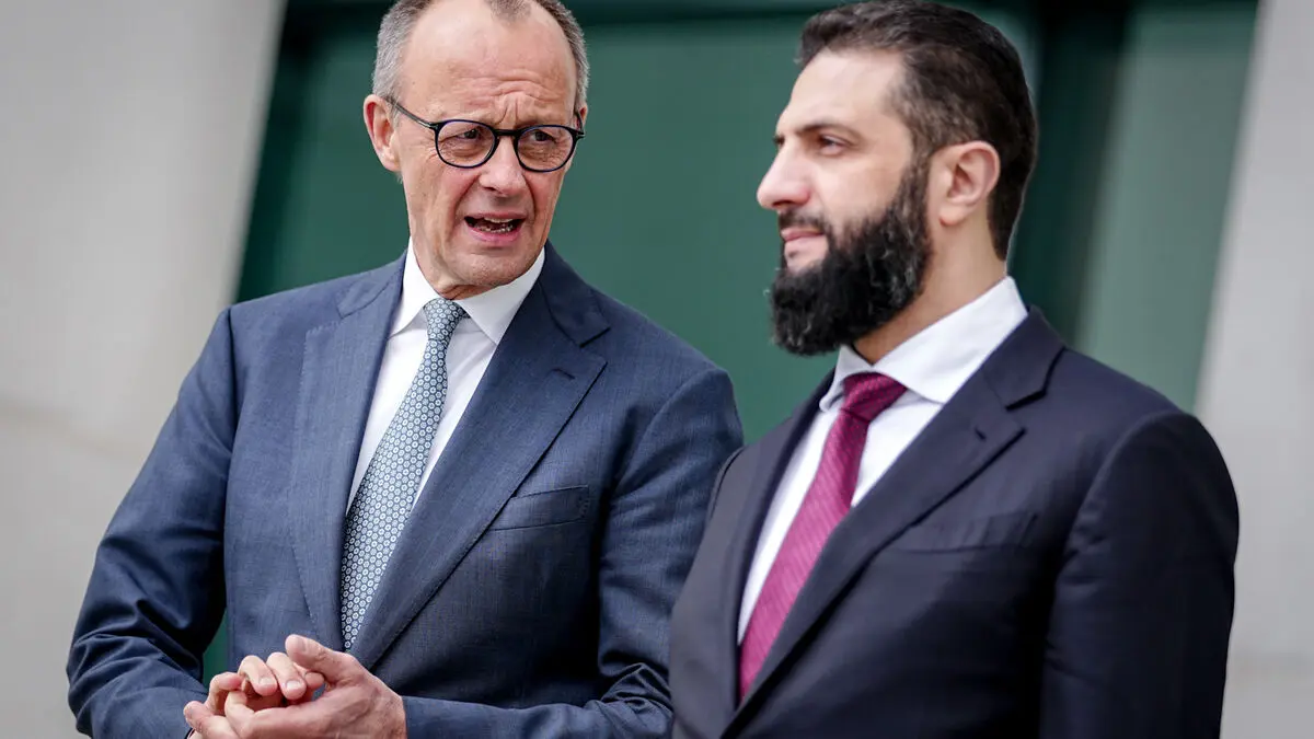 Merz says 800,000 Syrians in