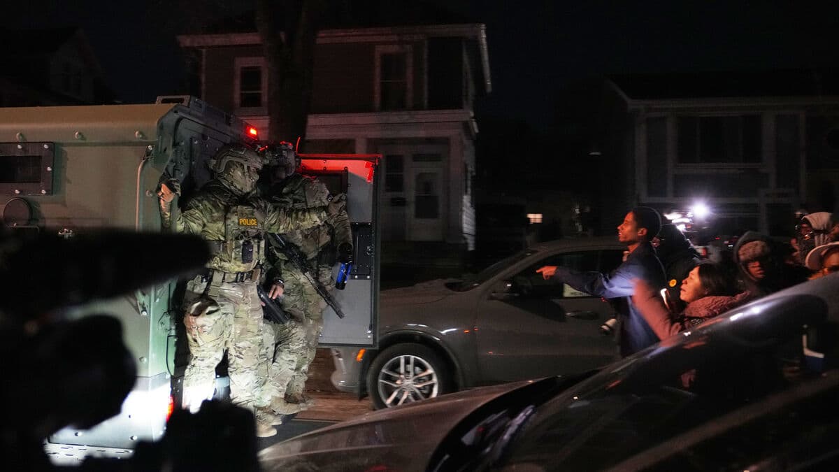 Gunfire and protests in Minneapolis as Trump threatens to invoke Insurrection Act